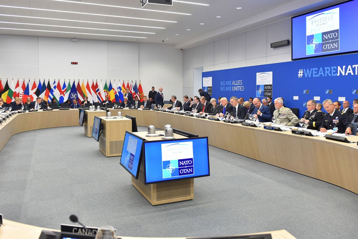 Attendees at a NATO meeting inside the new HQ