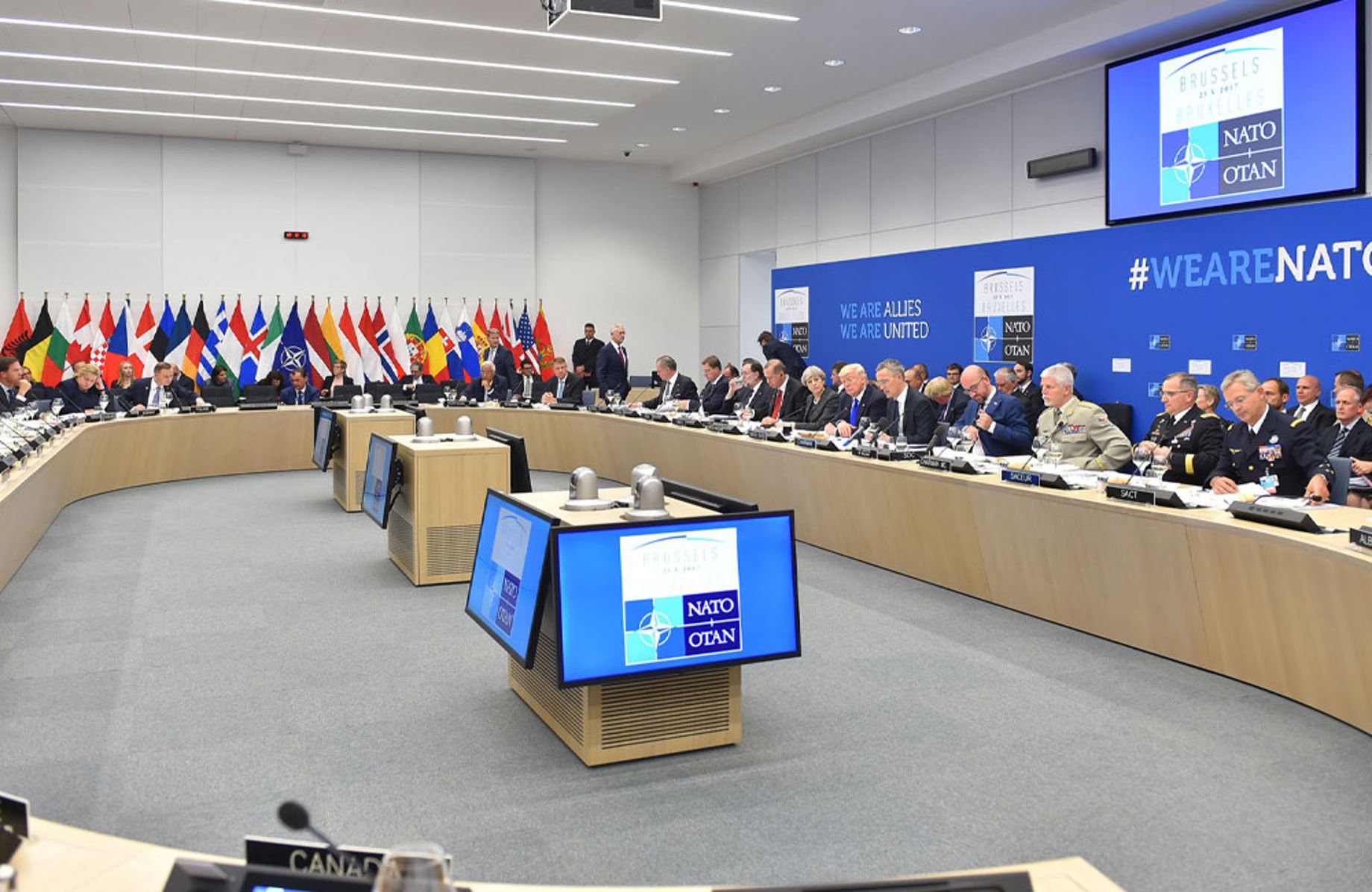 Attendees at a NATO meeting inside the new HQ