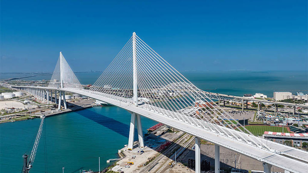 A large white bridge over a body of water.
