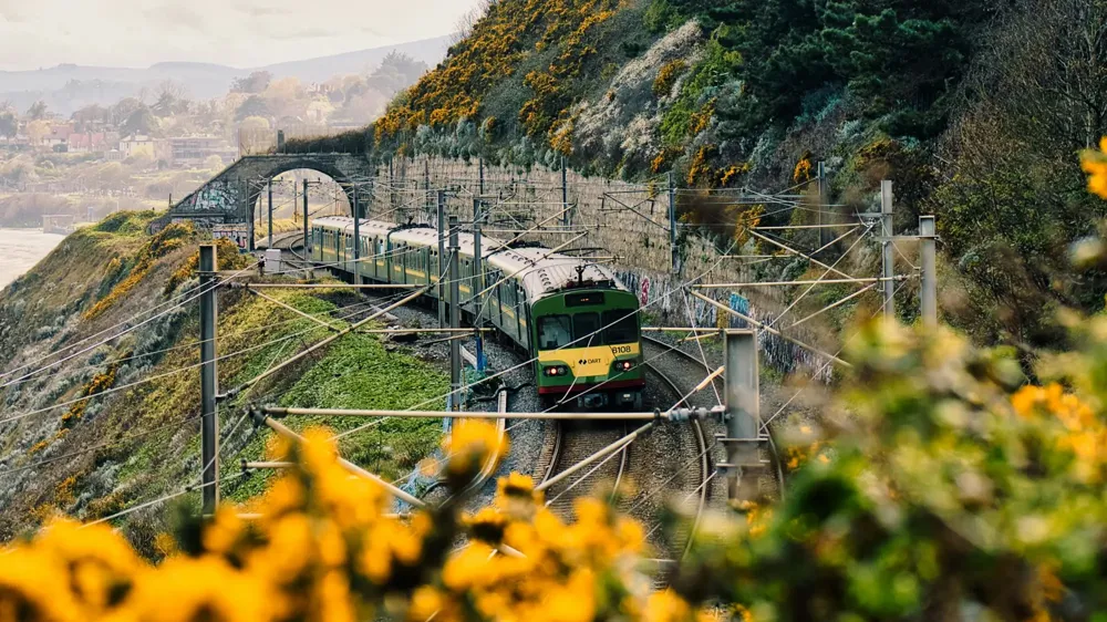 Electric train running along a coastal track