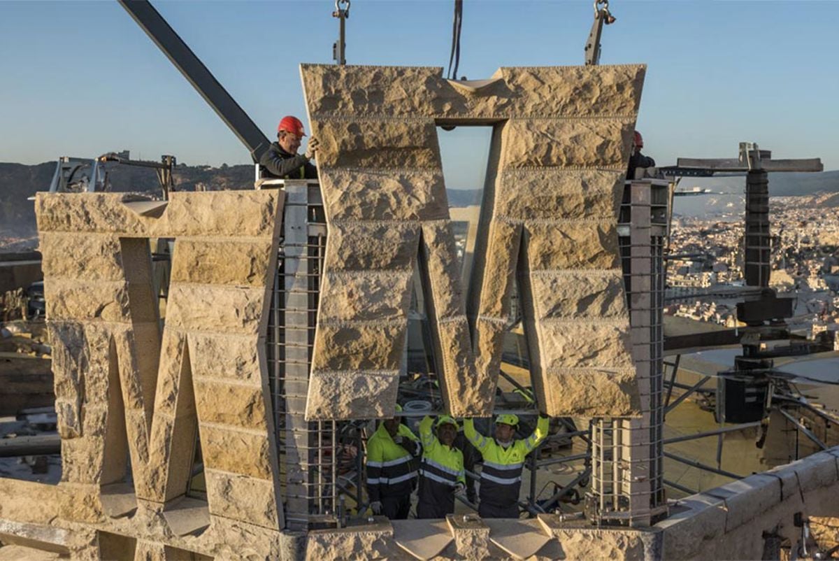 Prefabricated concrete parts being lowered into place