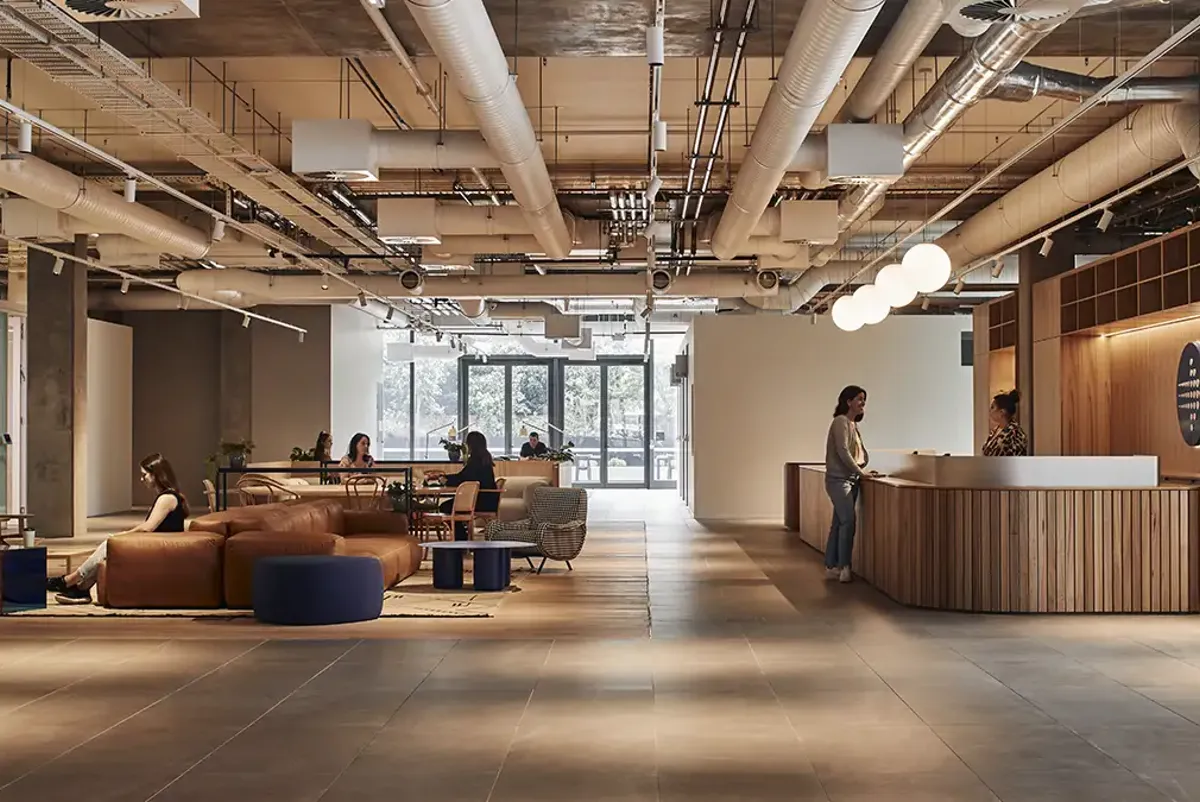 The reception area with comfortable lounge chairs and large windows for natural light