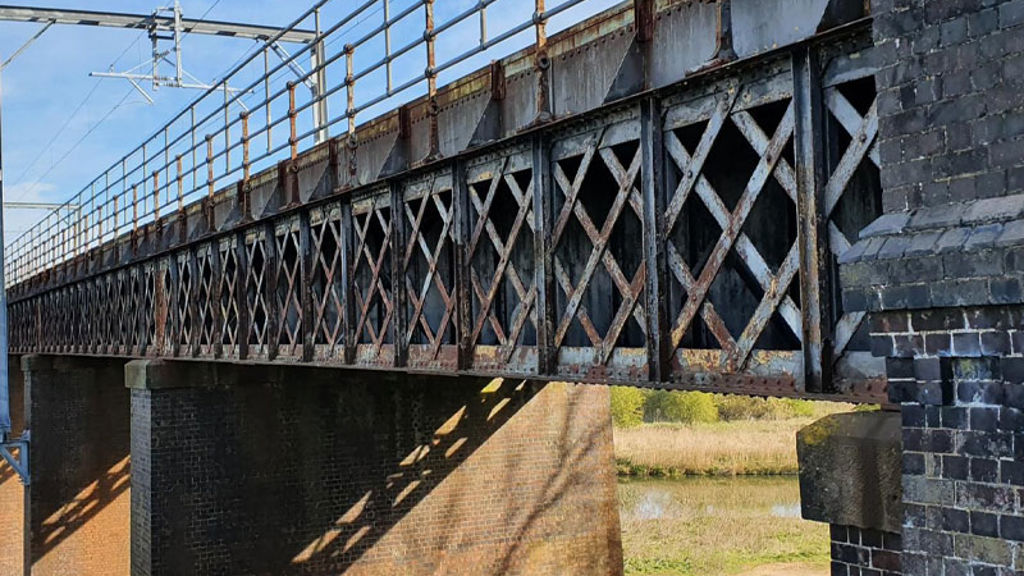 A bridge with a stone wall.