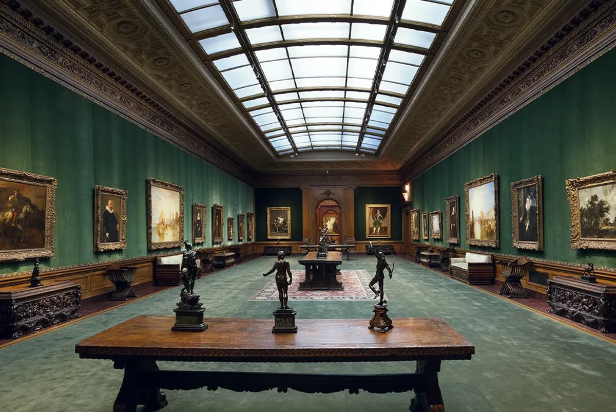 A room with paintings on the walls.