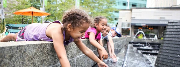 Children playing in a fountain