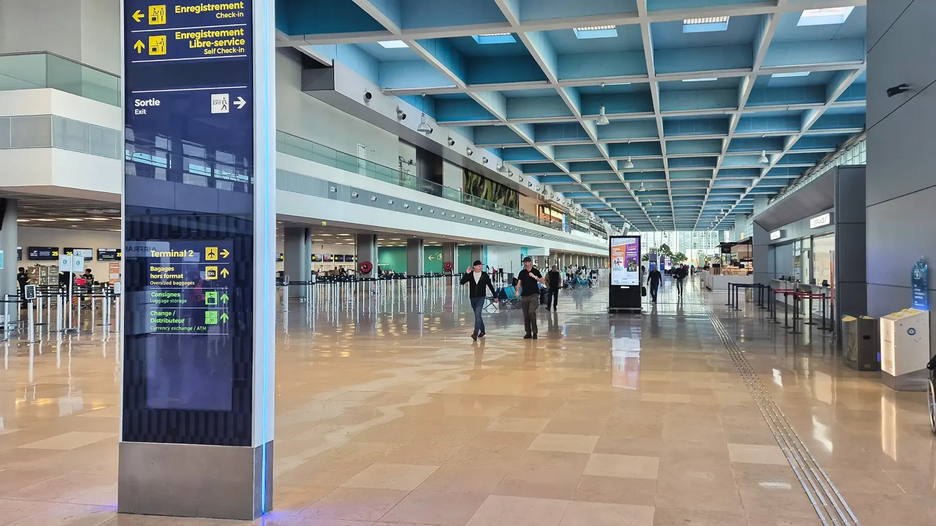 A group of people walking in an airport terminal