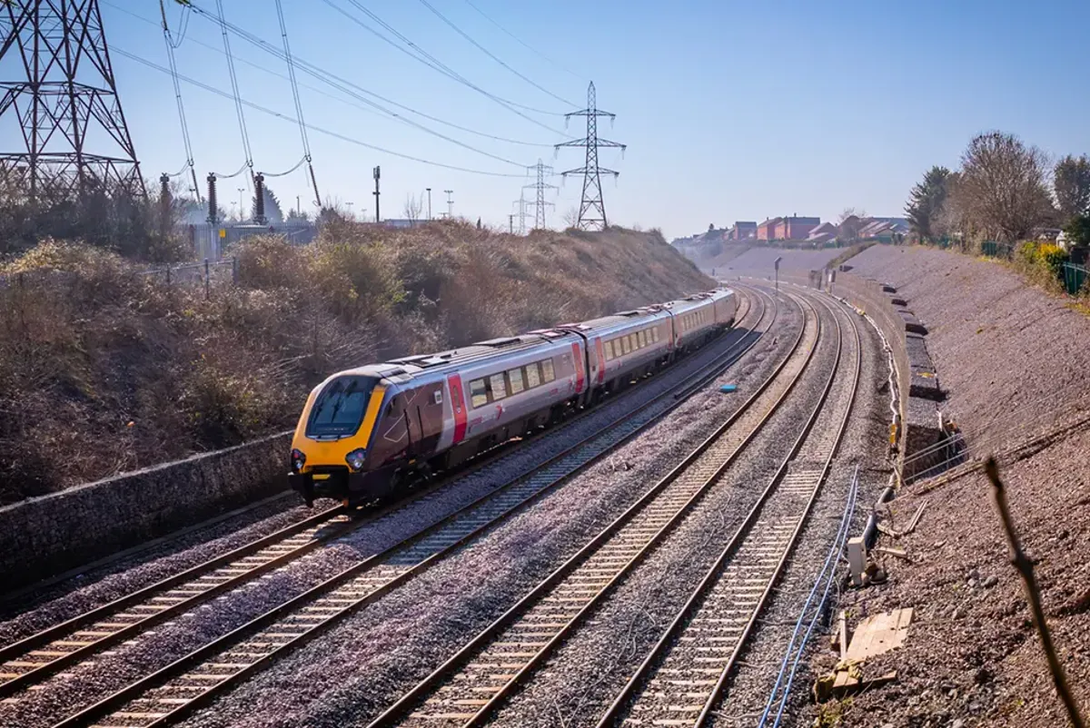 Train travelling along track in the UK